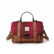 Front view of Fuchsia Red Tartan Harris Tweed® satchel with detachable strap and silver clasp detail.