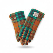 Harris Tweed ladies gloves in orange-blue tartan front view on white background