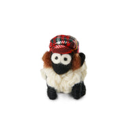 Knitted wool sheep keyring wearing a tartan Jimmy hat, on a plain white background.
