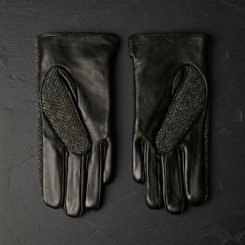 Close-up of Harris Tweed® label on black and grey herringbone ladies gloves.