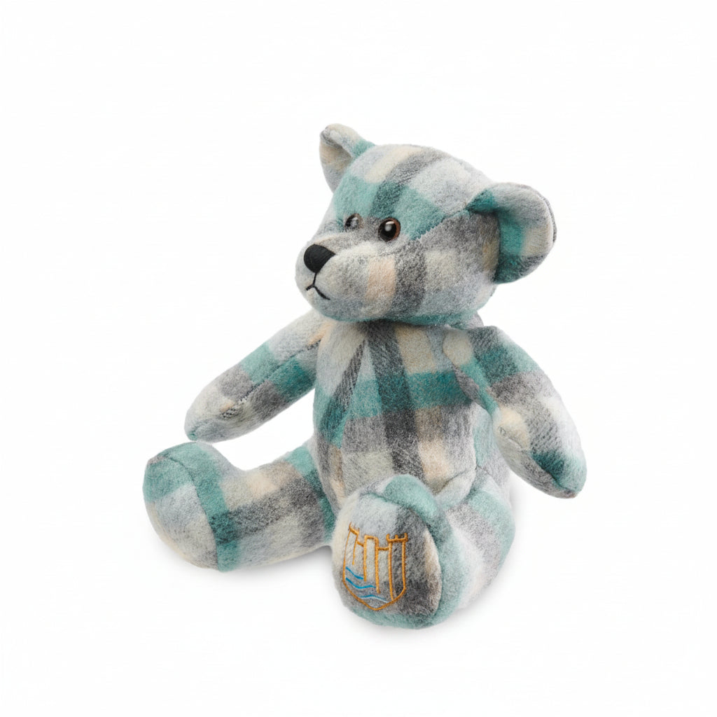 Lambswool teddy teal Islander tartan angled view on white background.