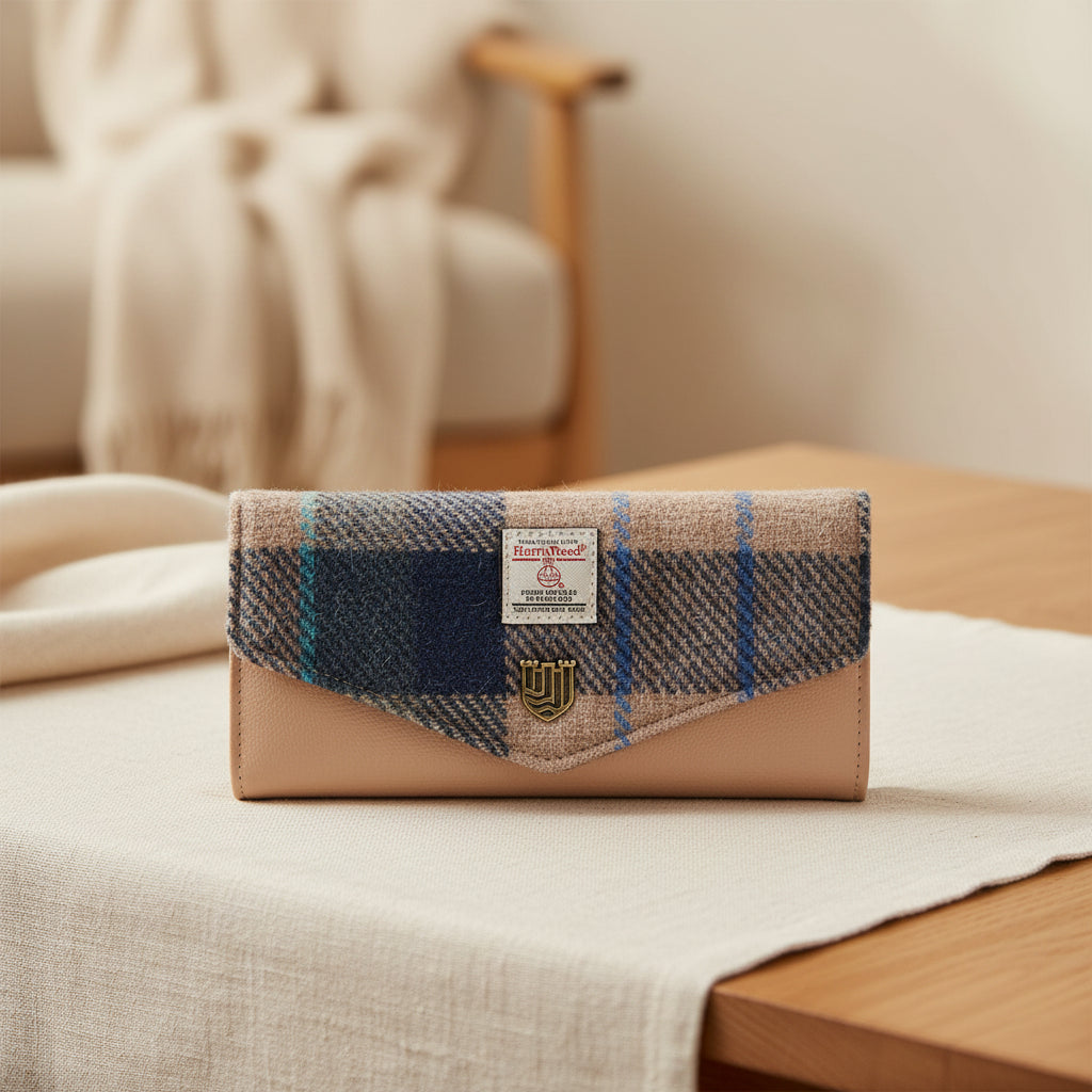 Plaid clutch bag with beige leather accents on a white background