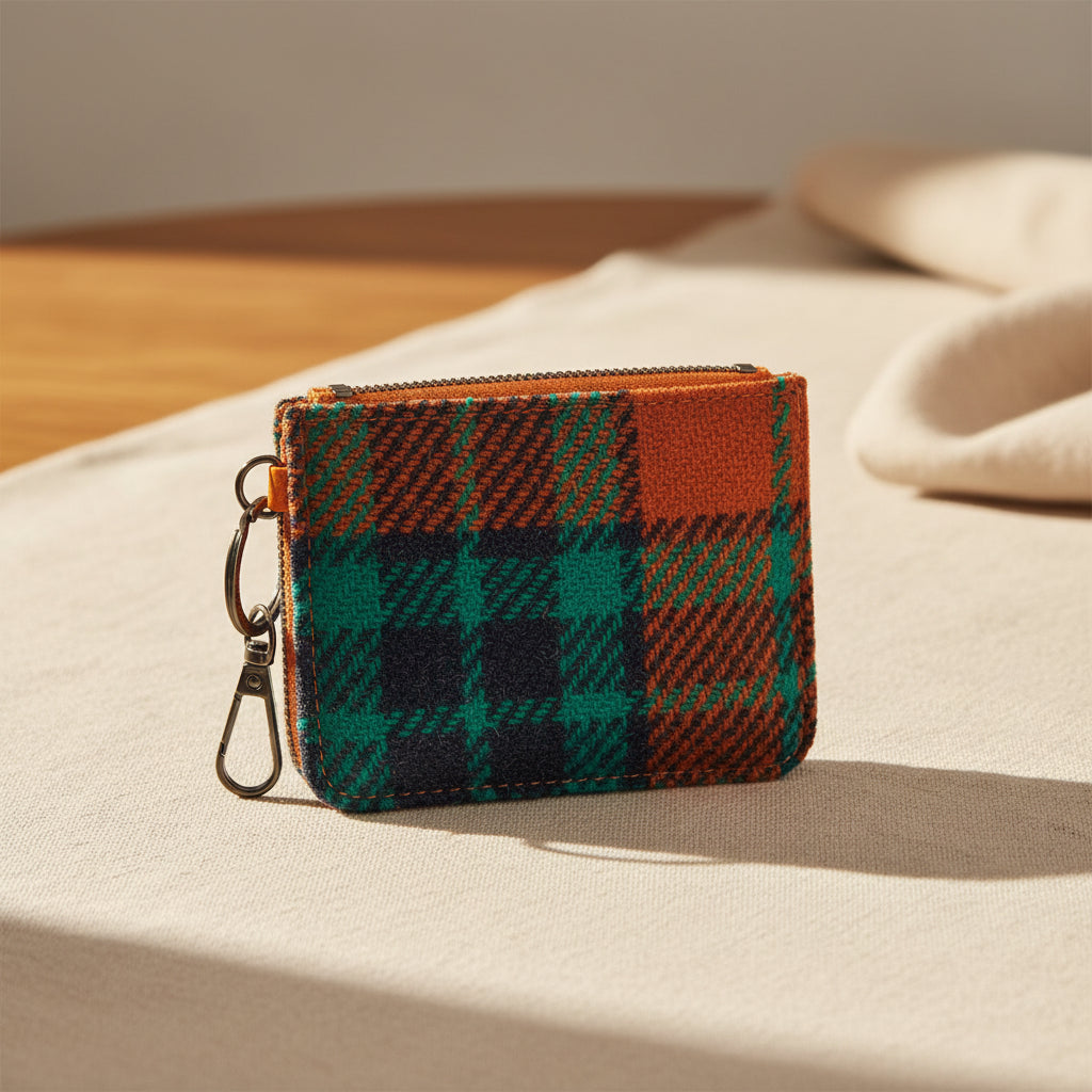 Plaid patterned pouch with a keychain on a white background