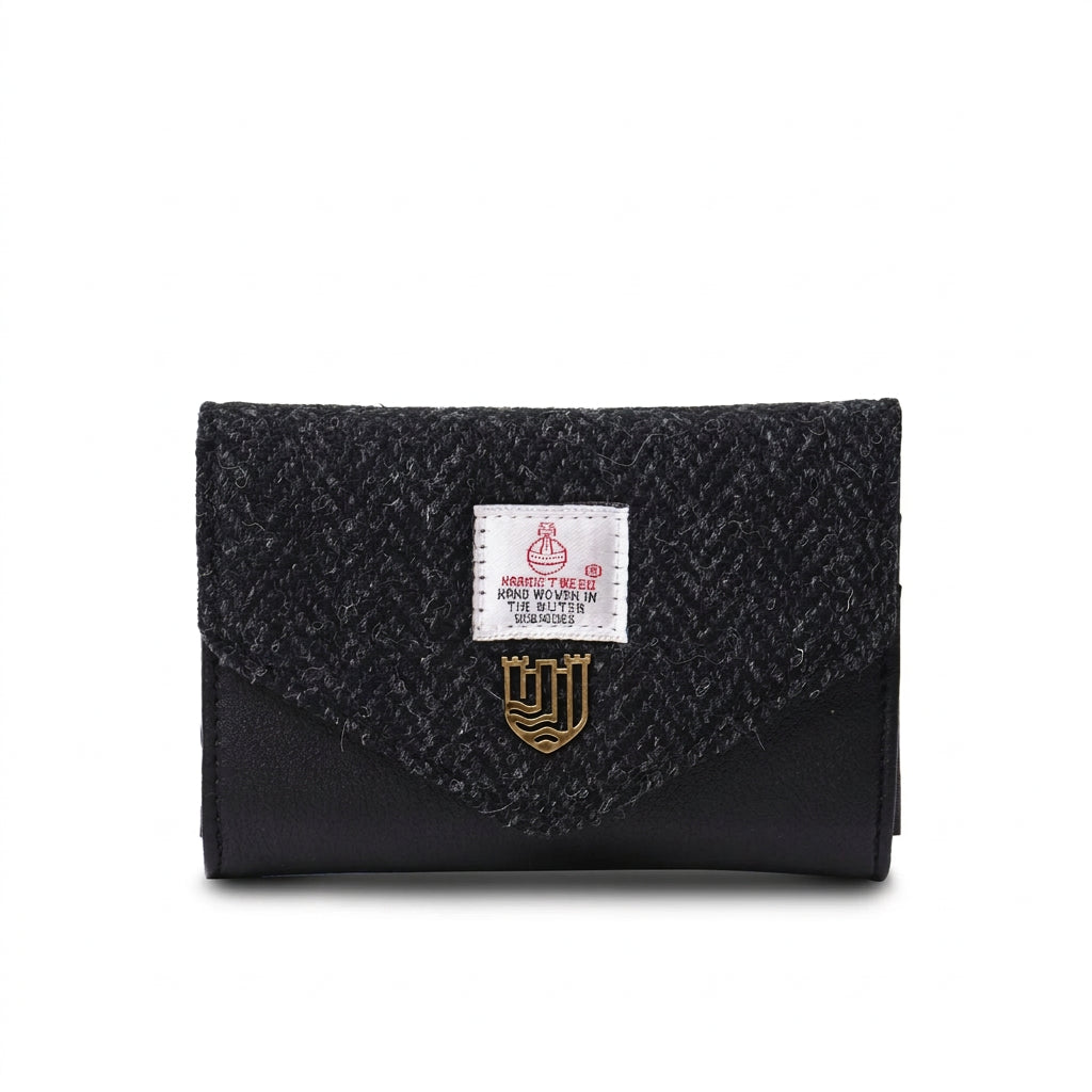 Black herringbone Harris Tweed clasp purse front view on white background.