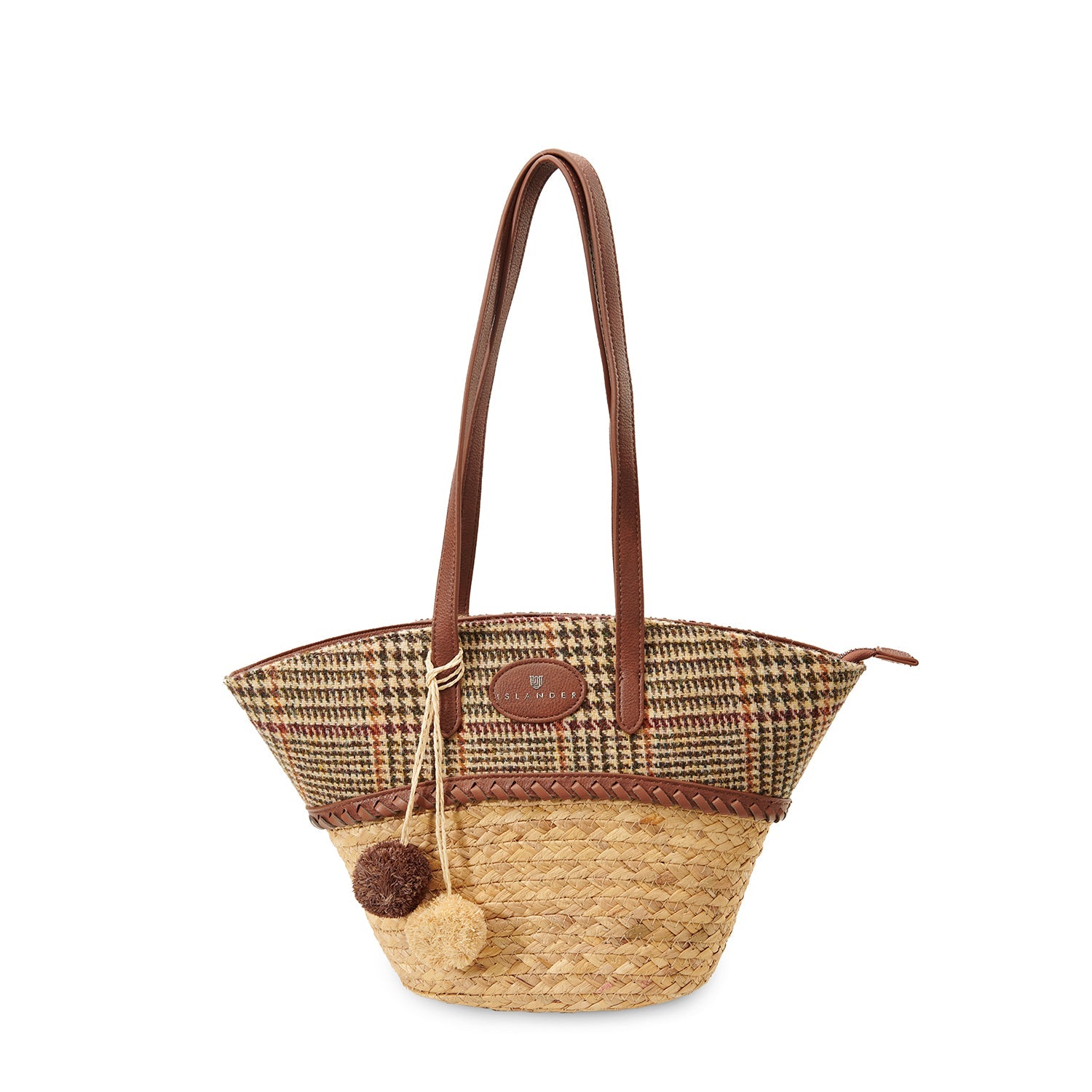 Beige dogtooth straw basket bag with a wool pom pom charm on the handle