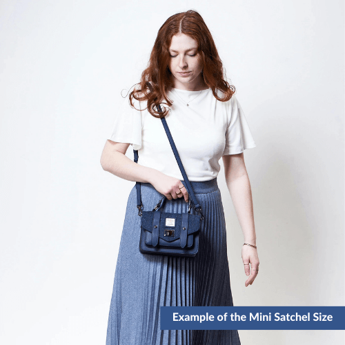 Example of a lady wearing a mini Harris Tweed Satchel.