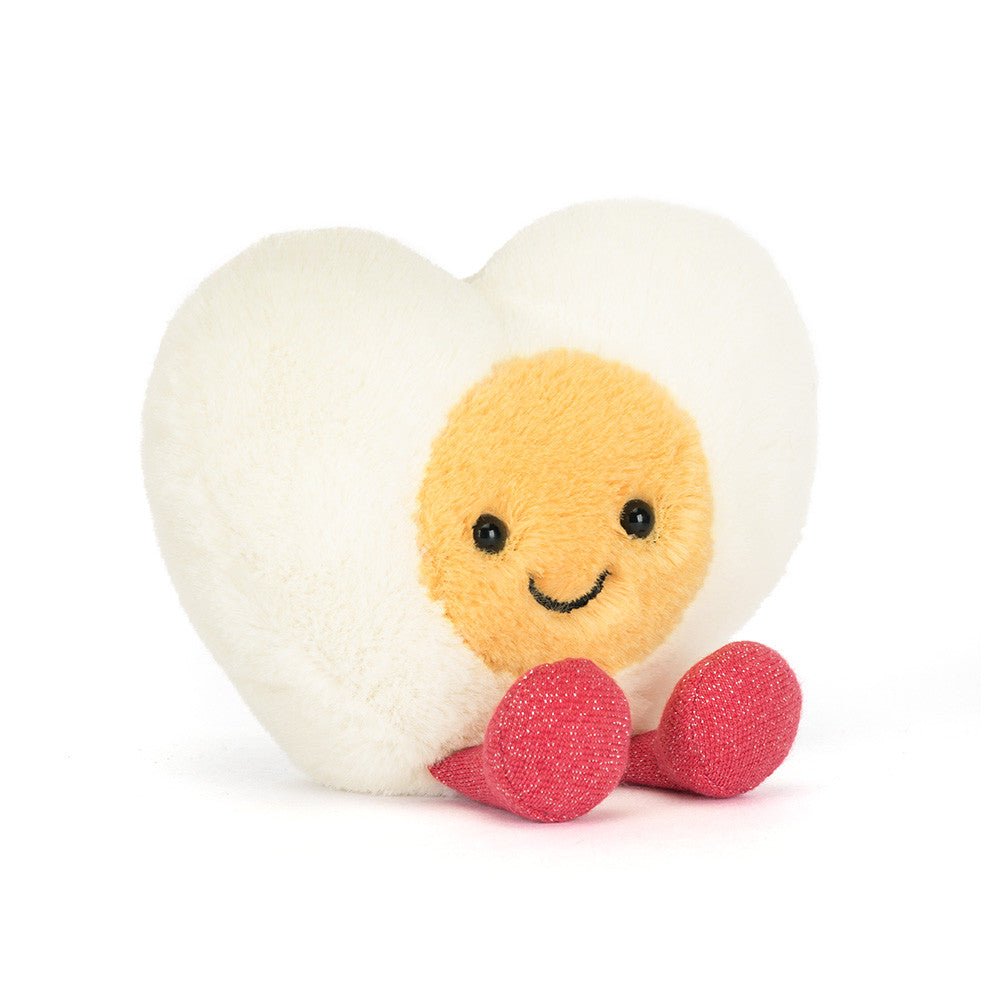 Jellycat Heart Boiled Egg soft toy with yolk face and pink feet on white