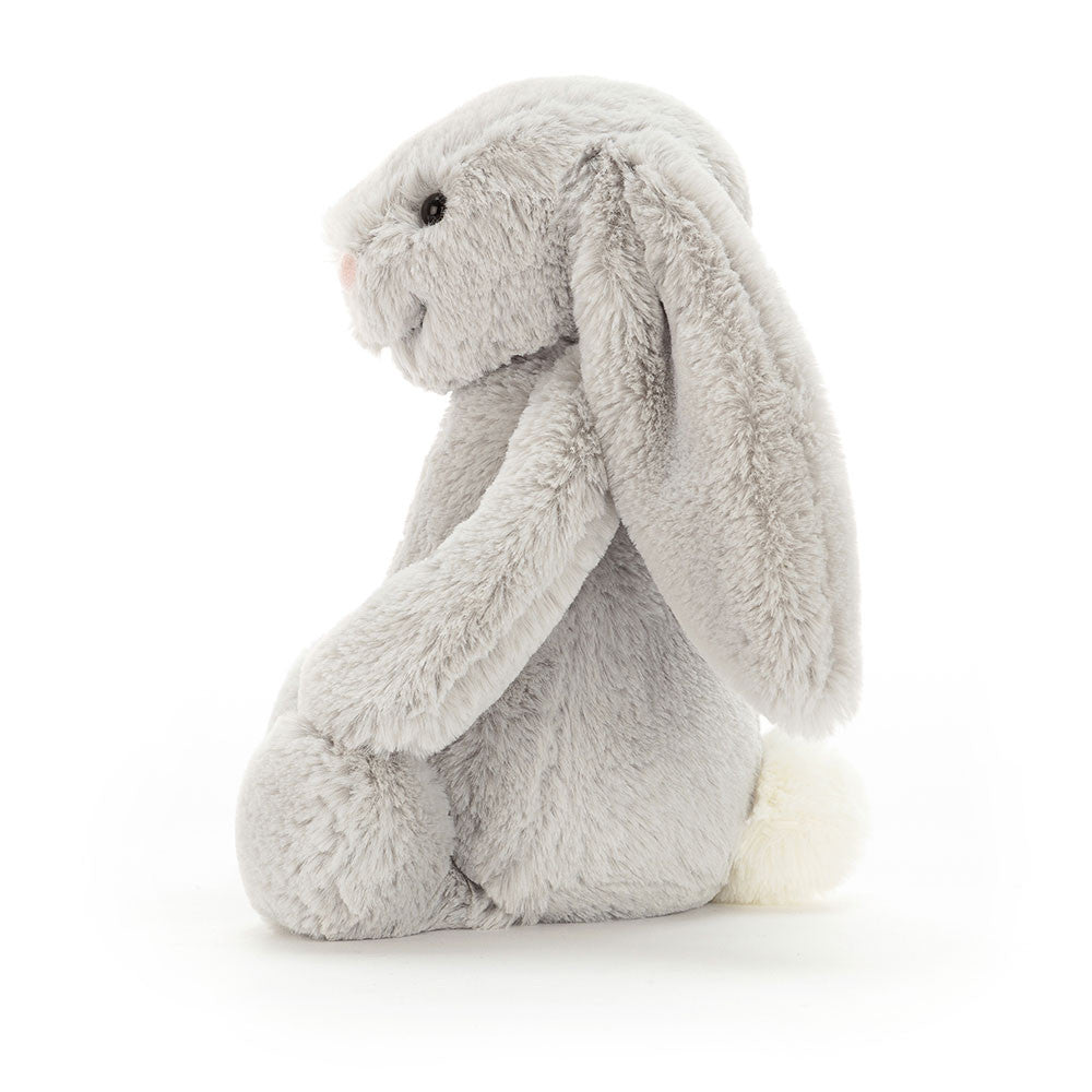 Side view of the silver grey Jellycat Bashful Bunny Original showing its long ears and fluffy tail