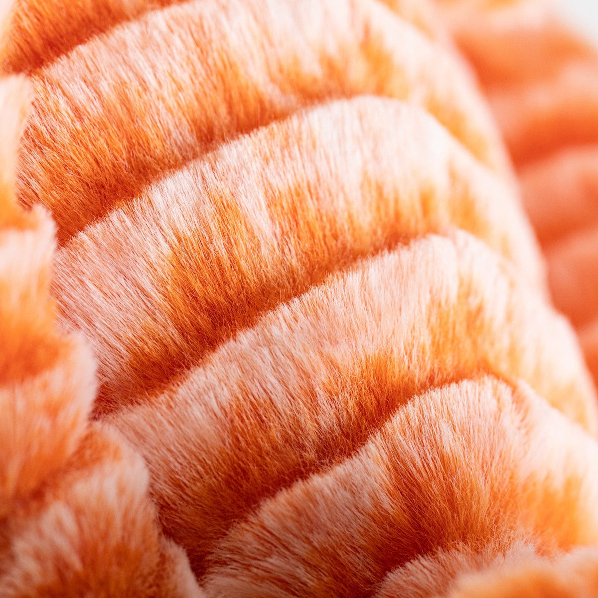 Close-up of the textured orange fur on Jellycat Fizzleskip Bunny