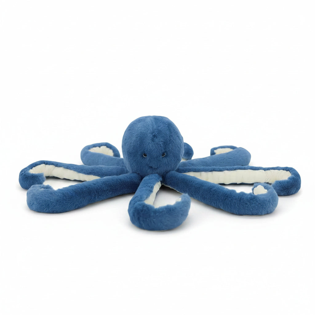 Deep blue octopus toy with cream ribbed tentacles spread out, front view