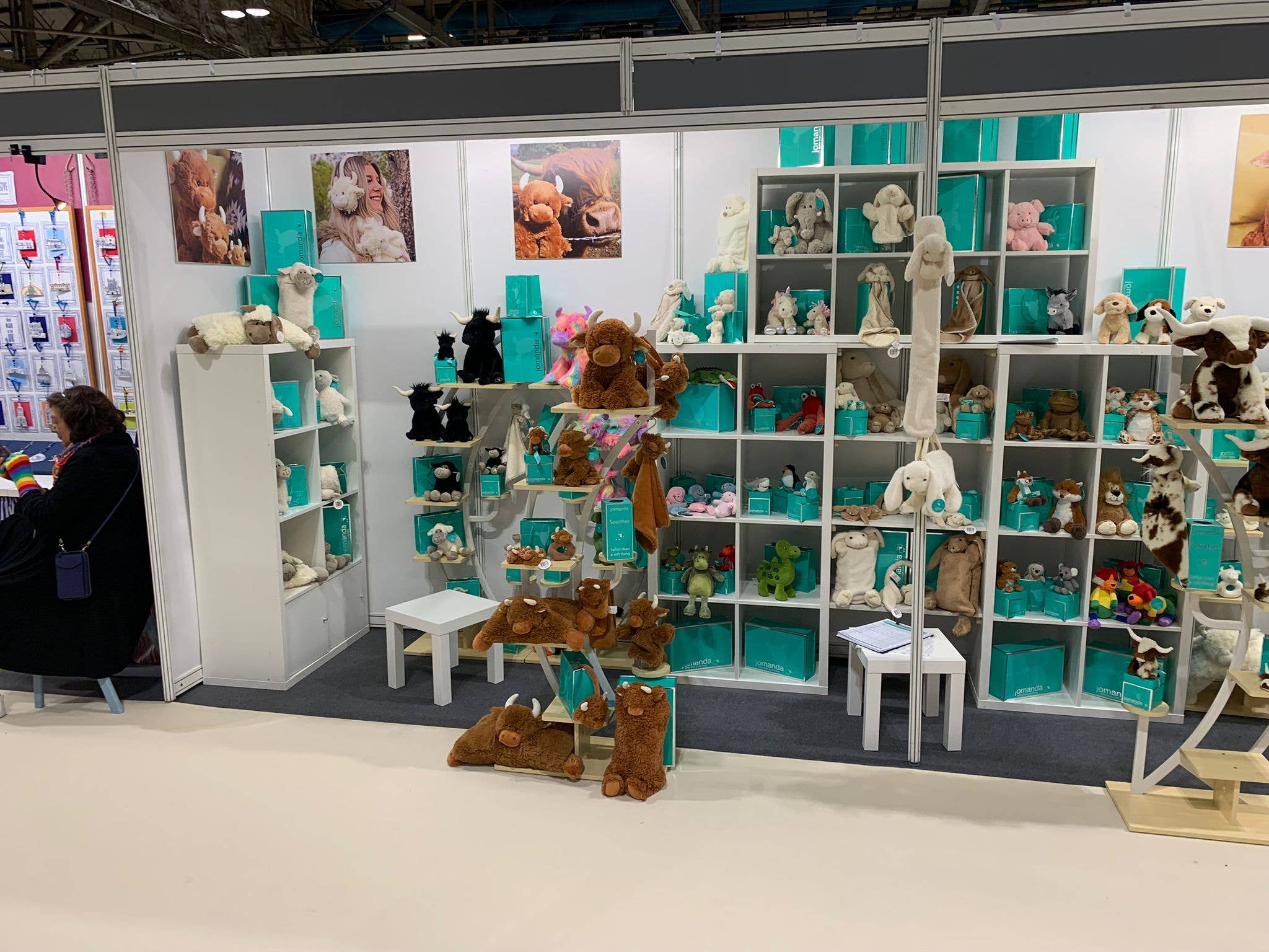 Jomanda soft toy trade stand with plush animals and turquoise gift boxes