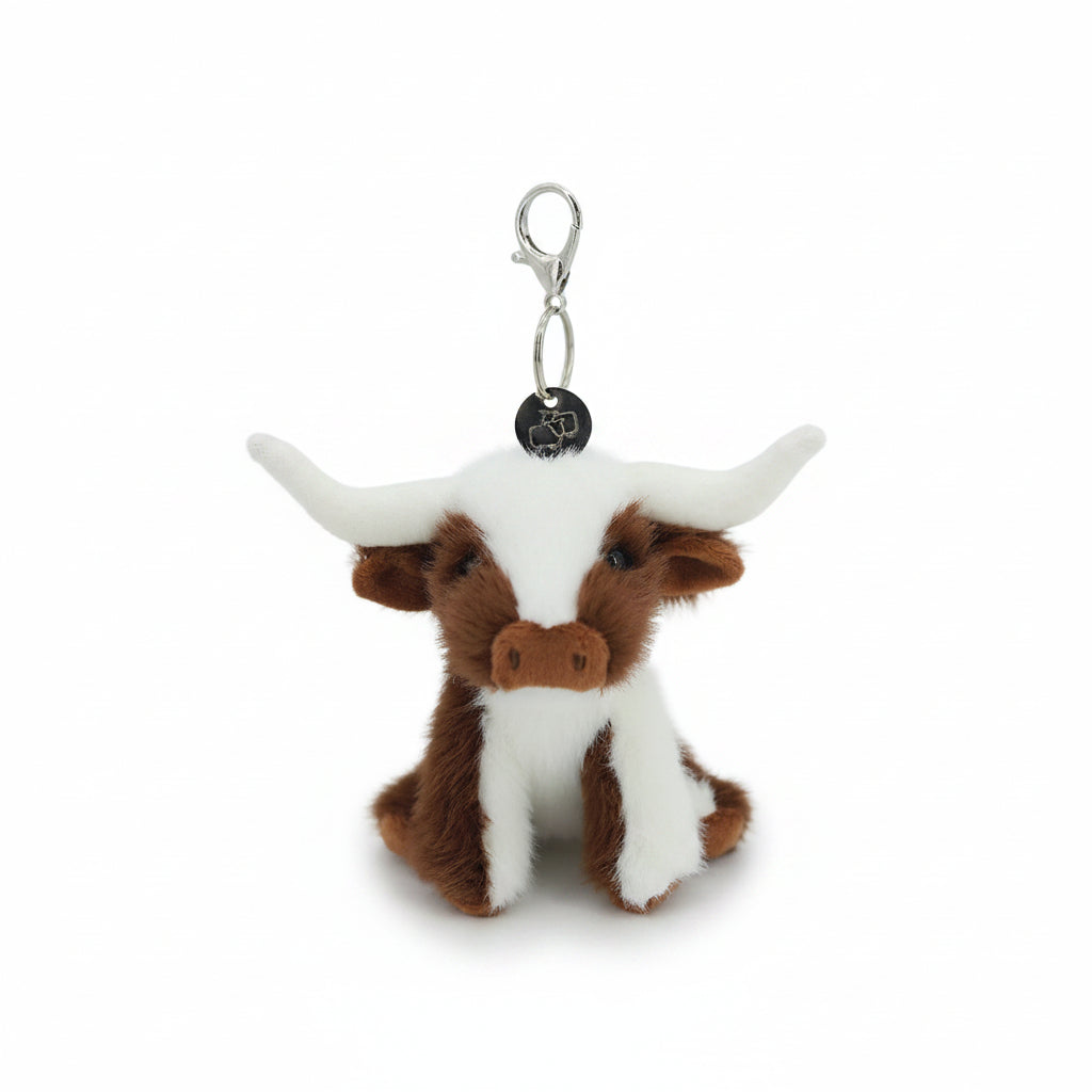 Brown and cream longhorn cow charm with large horns on a metal clasp
