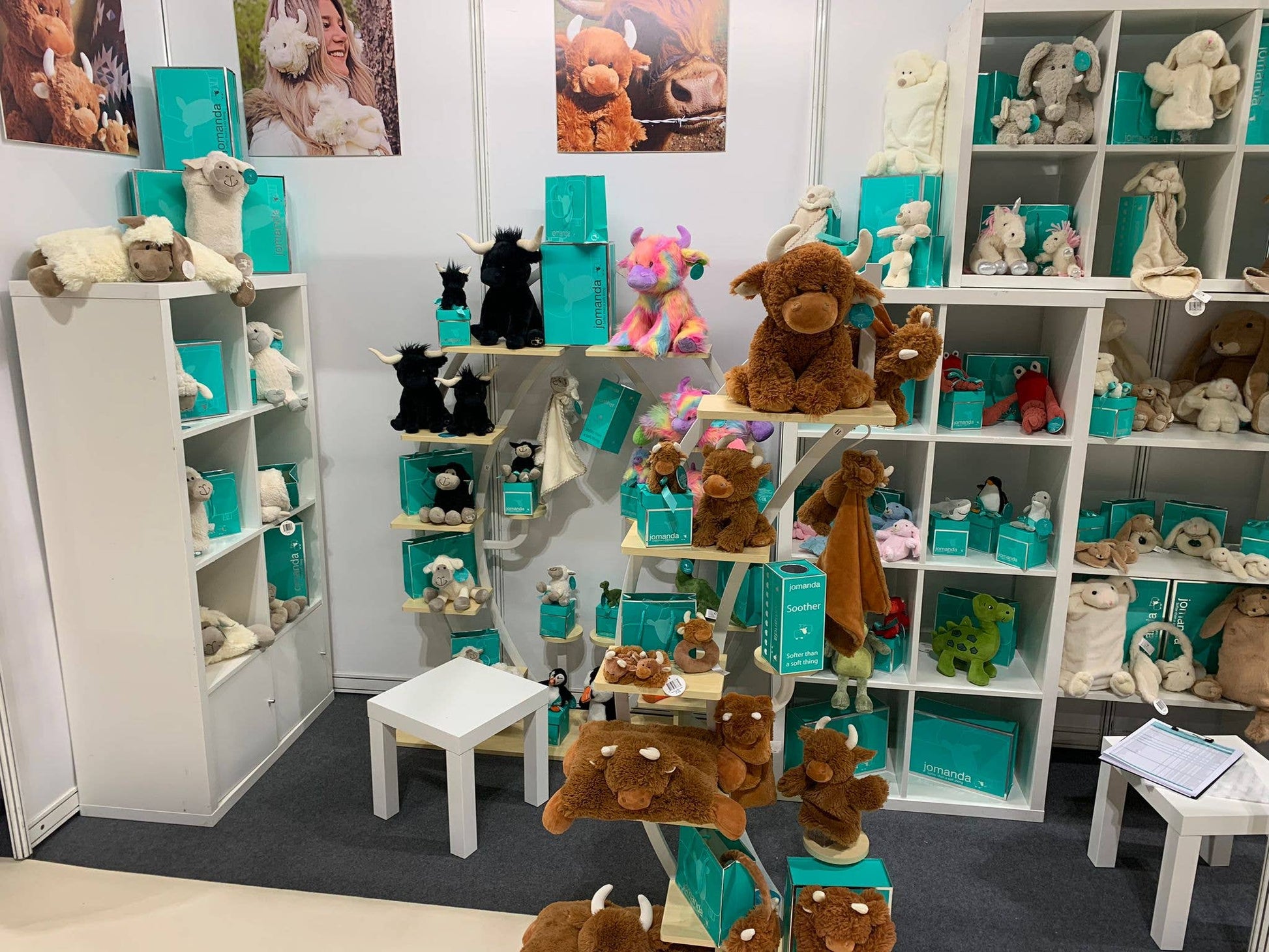 Jomanda plush display close view with black highland and rainbow cows