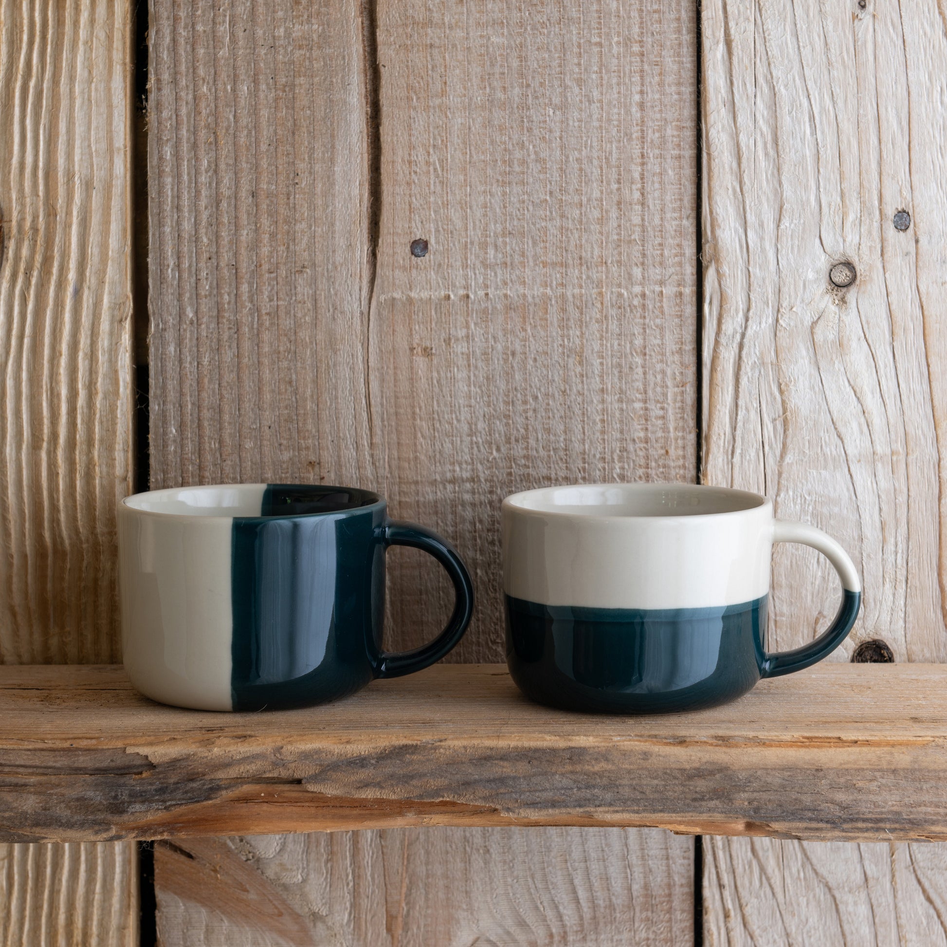 Sea green Rue mugs on a rustic wooden shelf