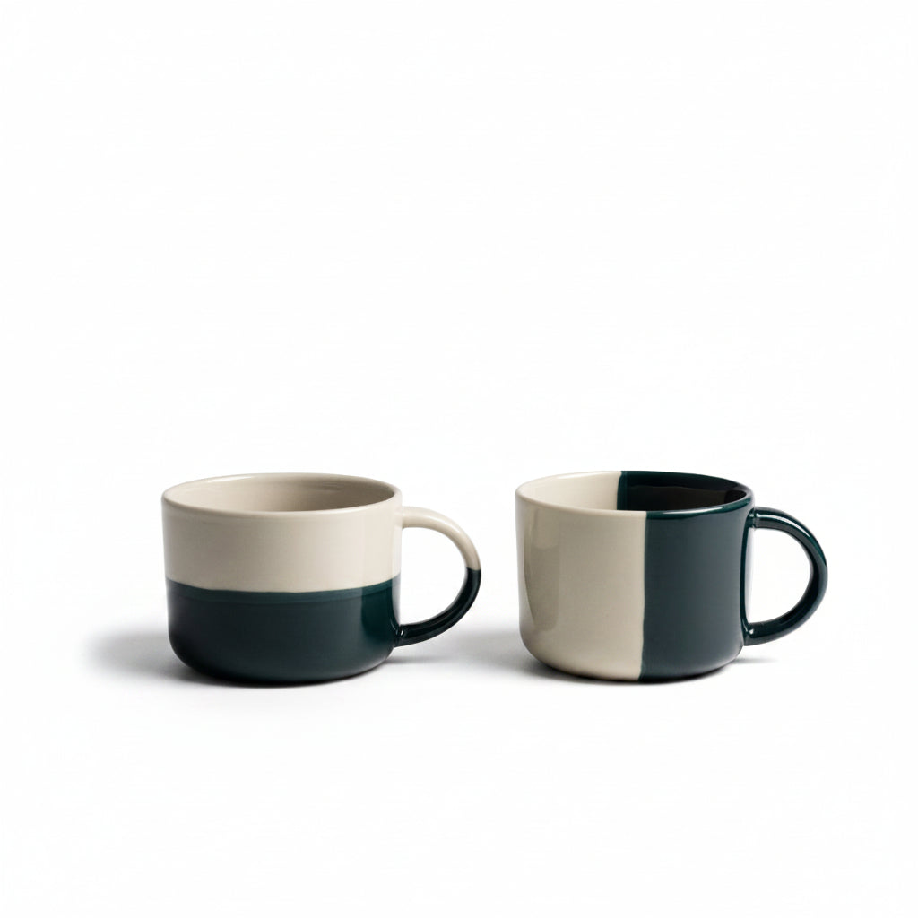 Two sea green dipped Rue mugs on a white background