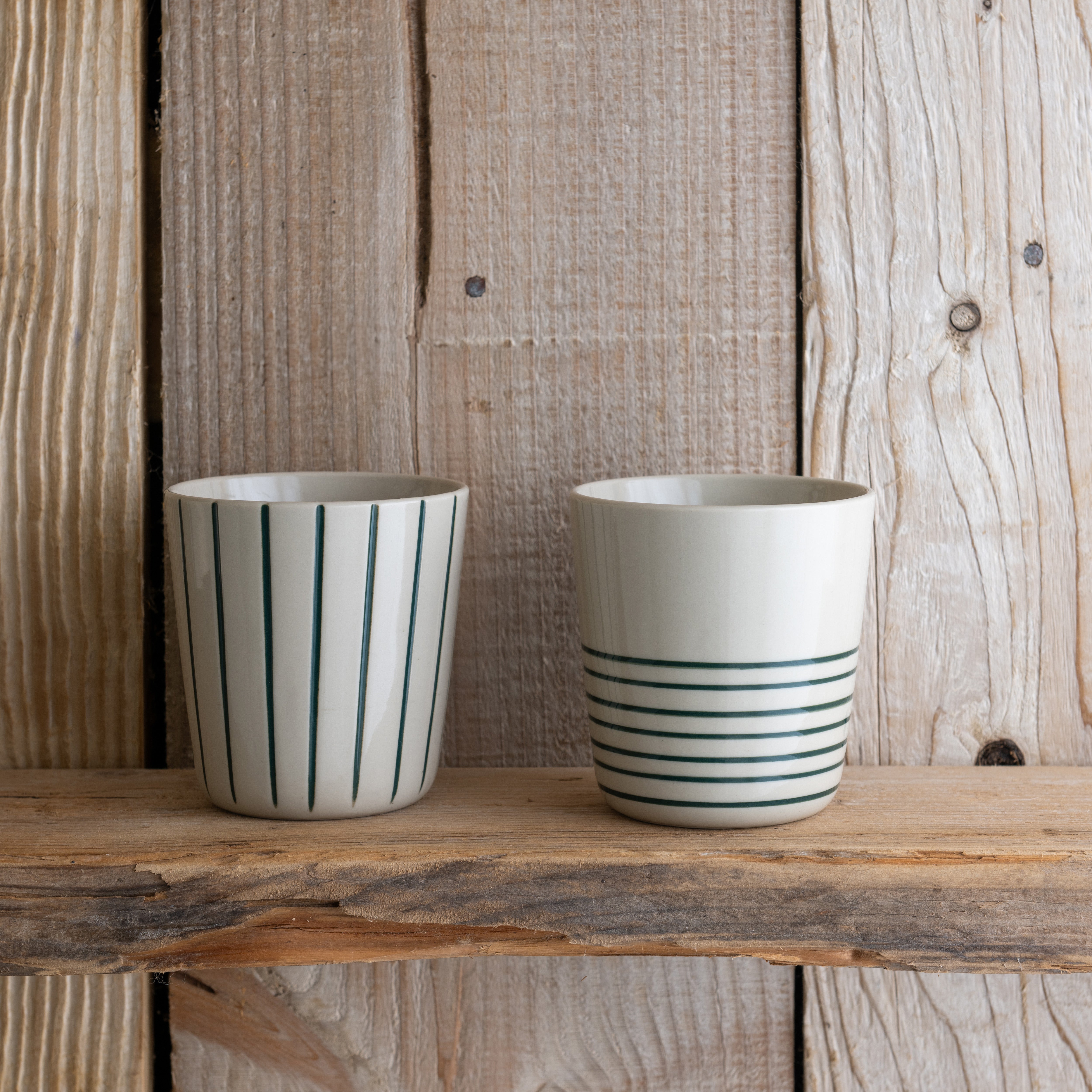Sea green Sorrel beakers on a rustic wooden shelf