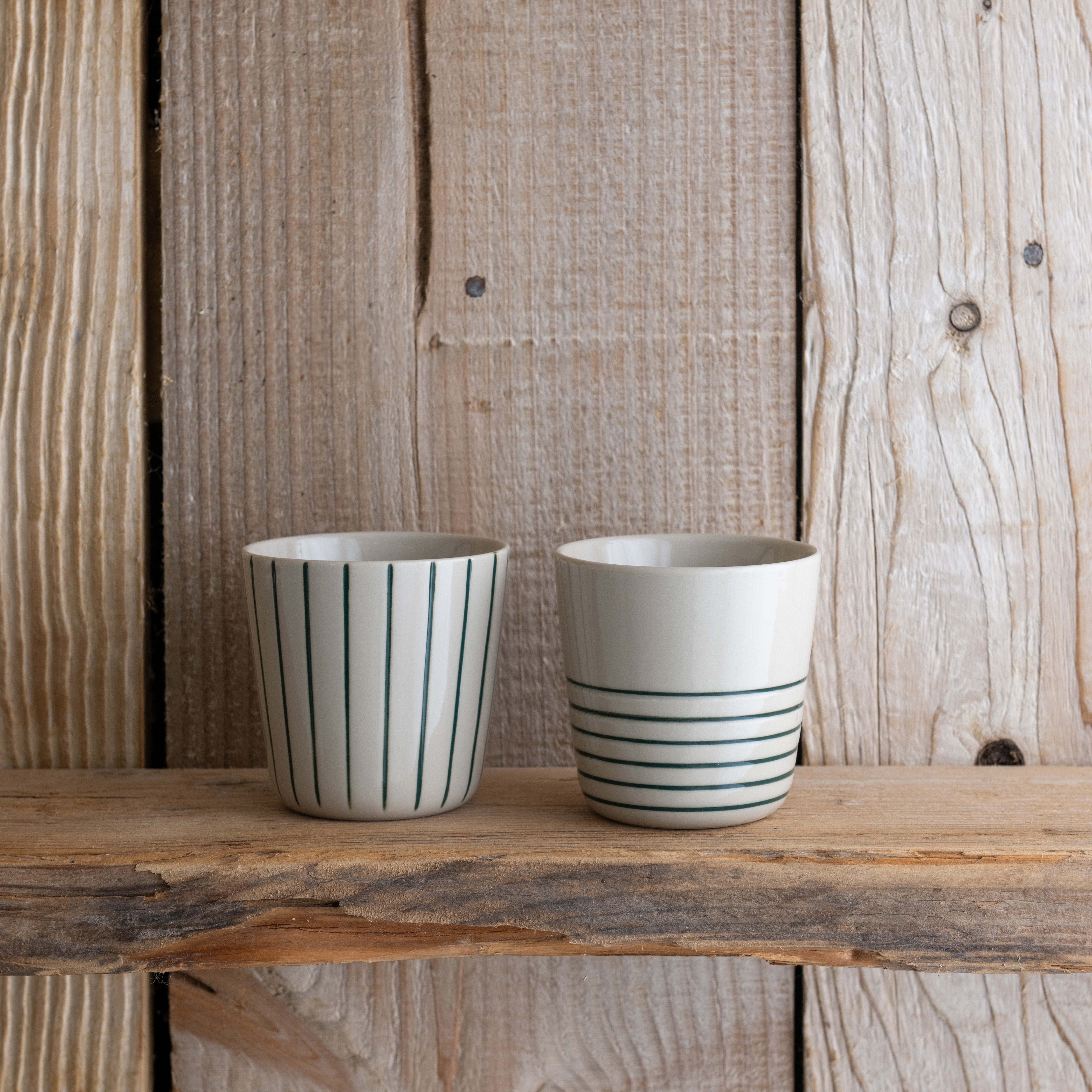 Small sea green Sorrel beakers on a rustic wooden shelf