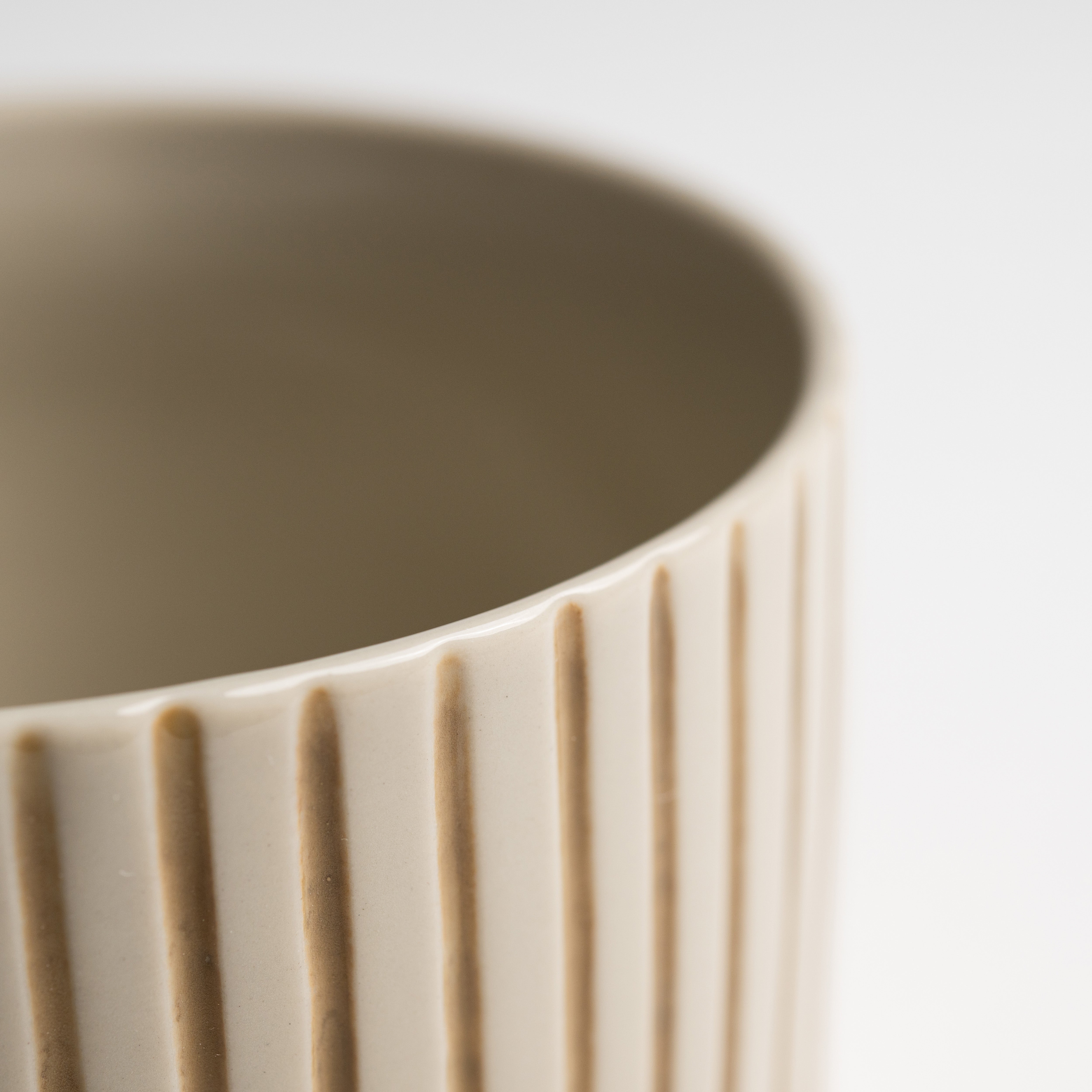Close up of the hand-etched mustard linework on a Yarrow mug