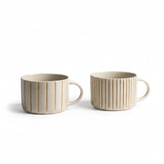 Pair of mustard yellow hand-etched Yarrow mugs on a white background