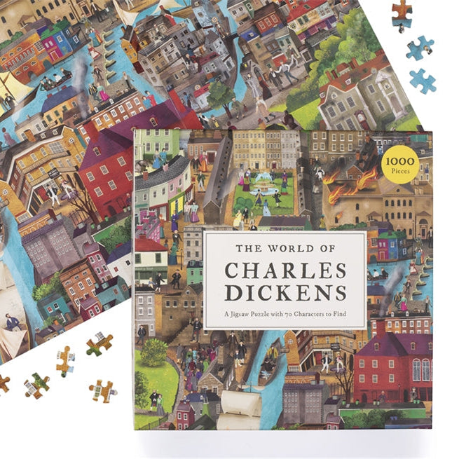 World of Charles Dickens jigsaw completed beside its box on a white background