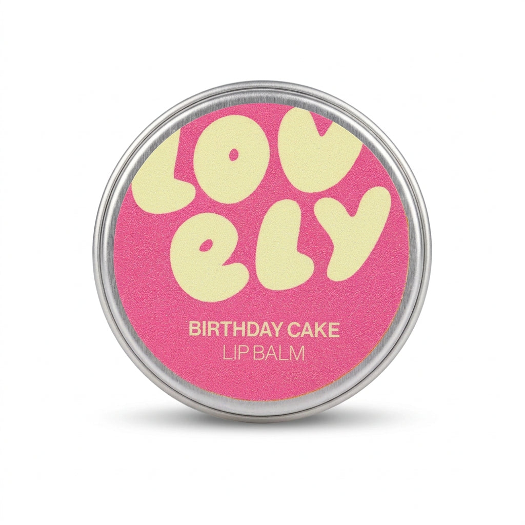 Hand holding the Birthday Cake lip balm tin