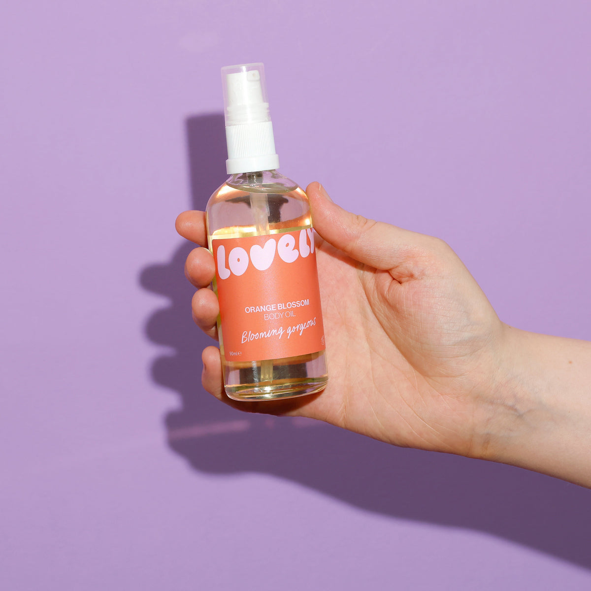Hand holding the Orange Blossom body oil