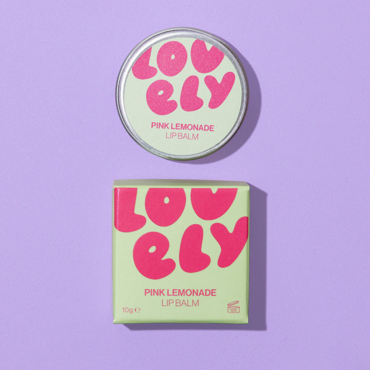 Pink Lemonade lip balm tin and box on a lilac background