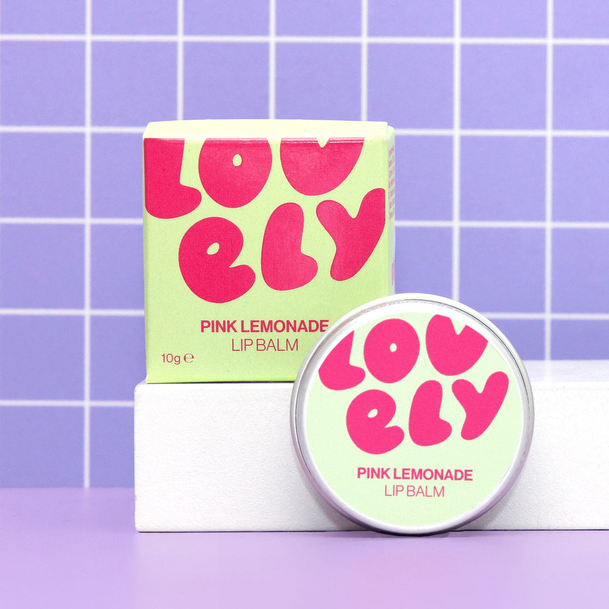 Pink Lemonade lip balm tin and box by Lovely Skincare styled lifestyle view