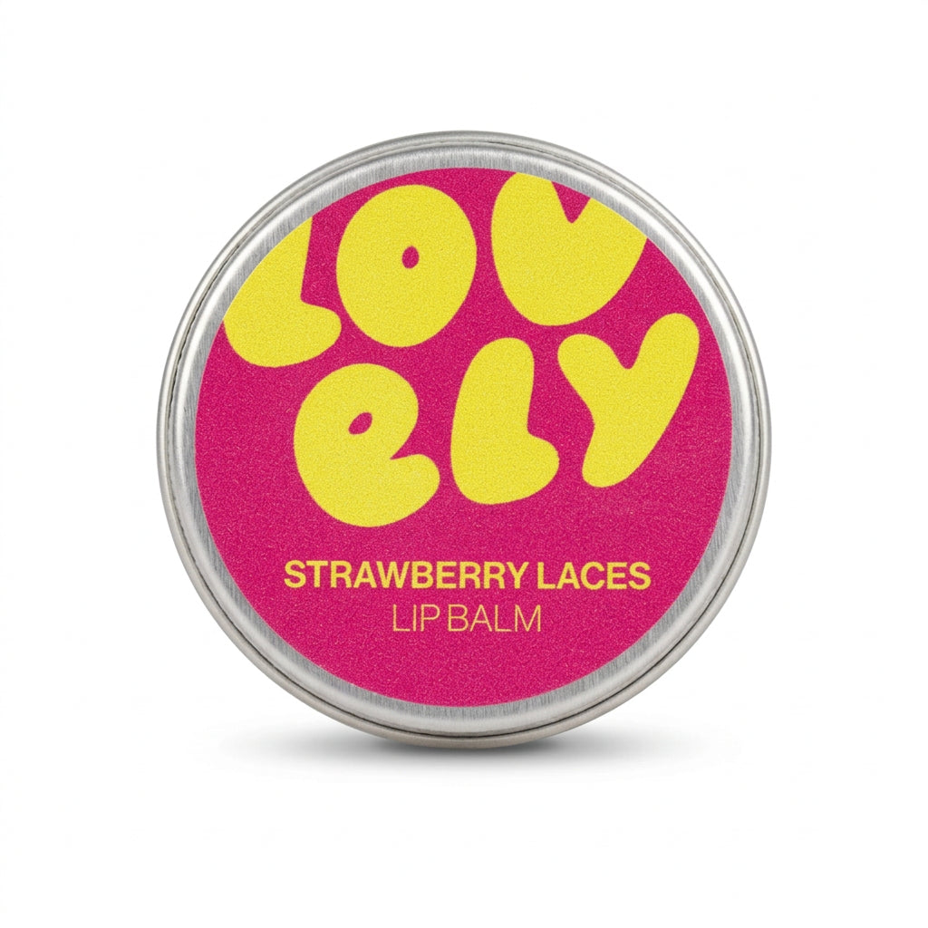 Hand holding the Strawberry Laces lip balm tin