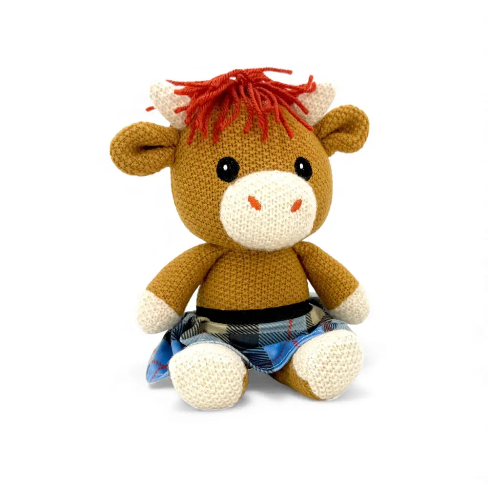 Alfie the crochet Highland cow seen from another angle showing his kilt