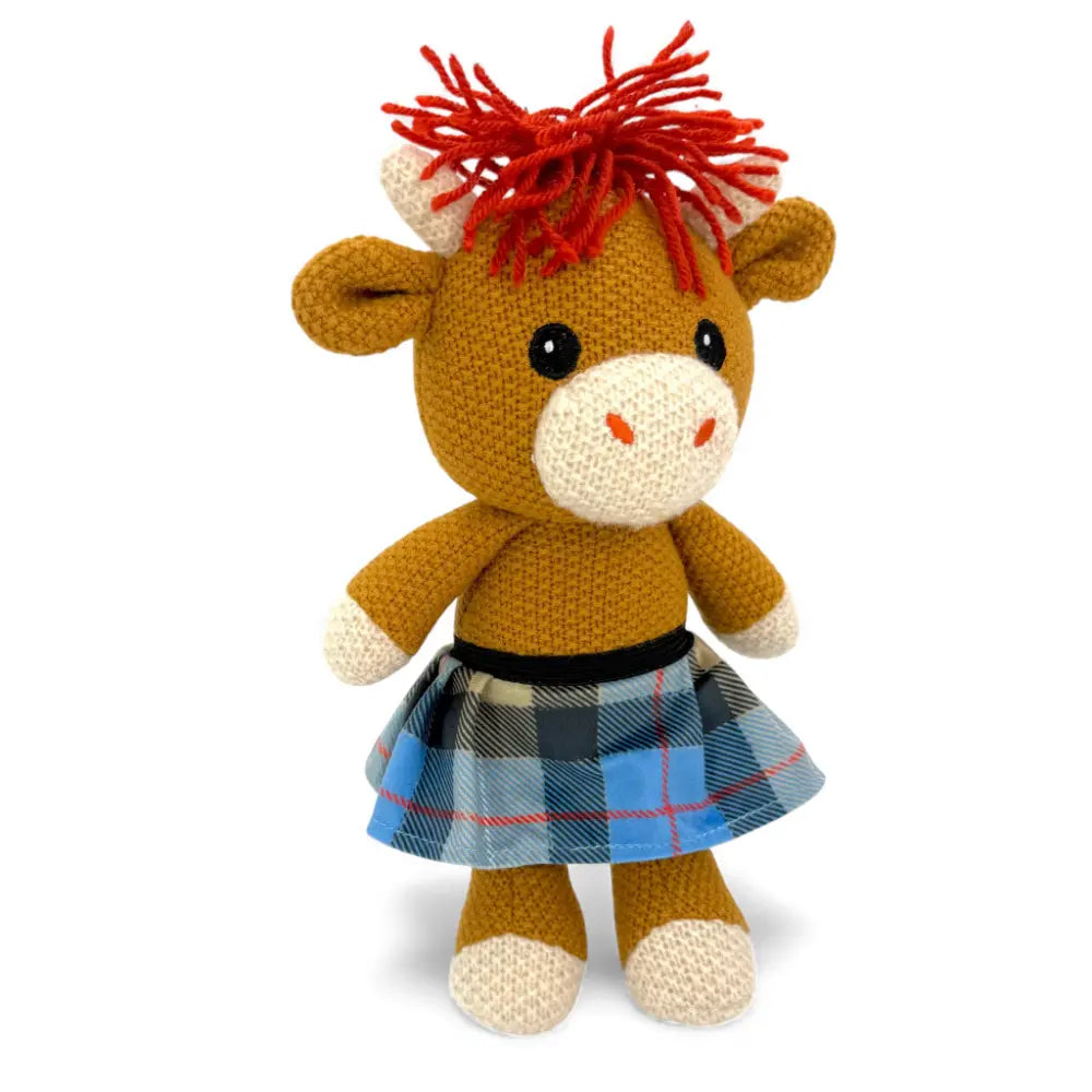 Hand-crocheted Alfie Highland cow doll in a blue tartan kilt with ginger topknot