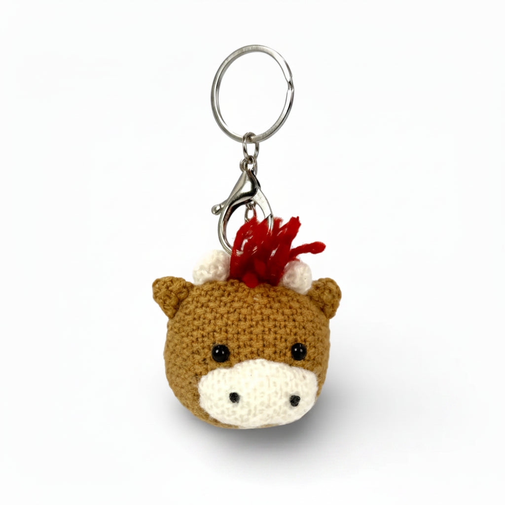 Close detail of the crochet stitching on the Highland cow keychain