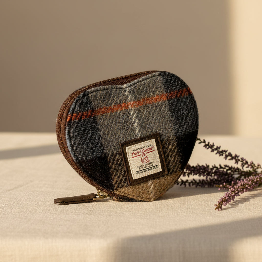 Heart-shaped pouch with plaid pattern and visible brand label on a white background