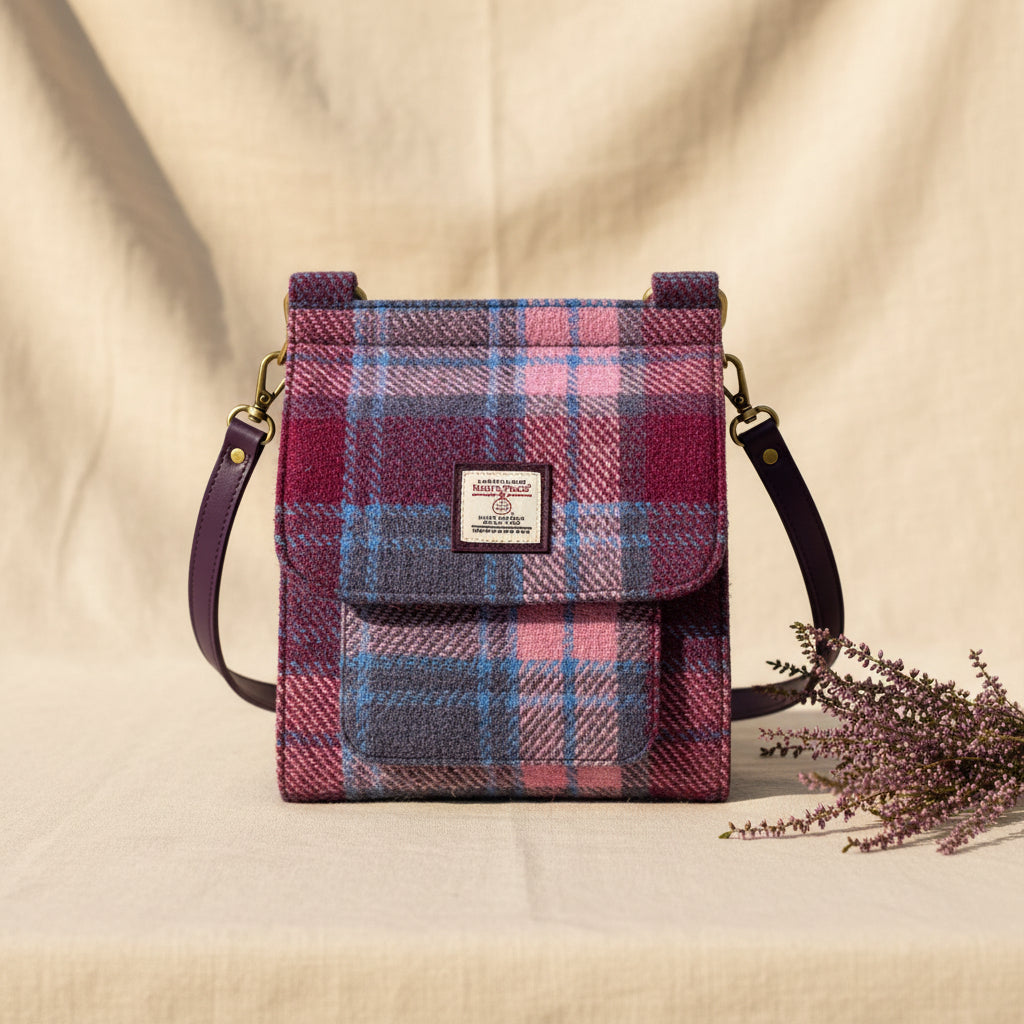 Plaid patterned bag with a visible brand label on a white background