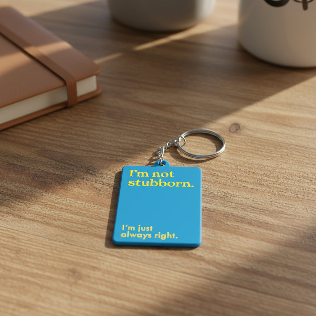 Blue keychain with yellow text on a white background