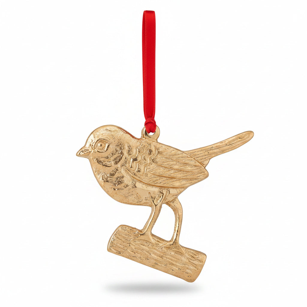 Gold aluminium robin on a branch decoration on red velvet, hanging on a tree
