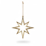 Gold eight-pointed aluminium star decoration hanging from jute string on a tree