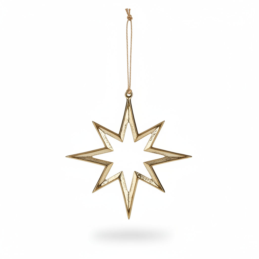 Gold eight-pointed aluminium star decoration hanging from jute string on a tree