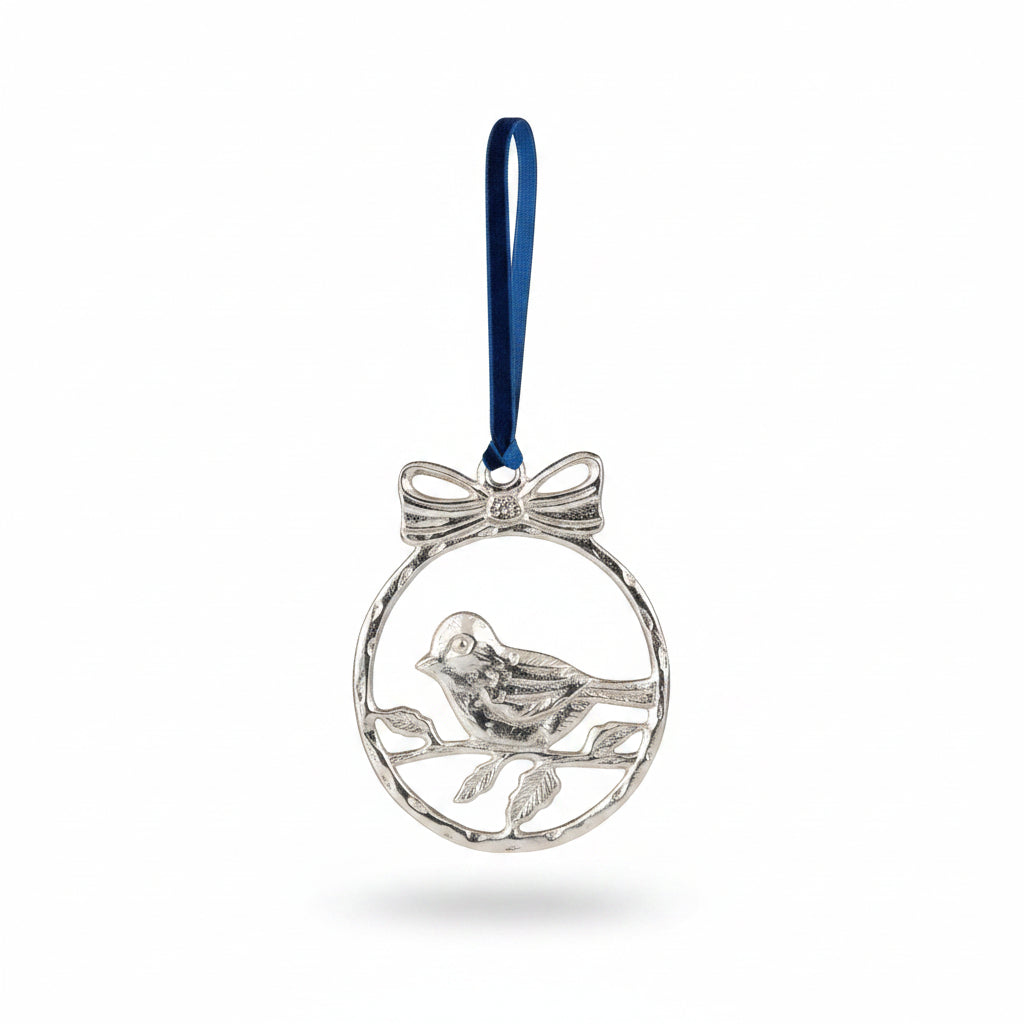Silver aluminium robin in a bowed ring on blue velvet, hanging on a tree