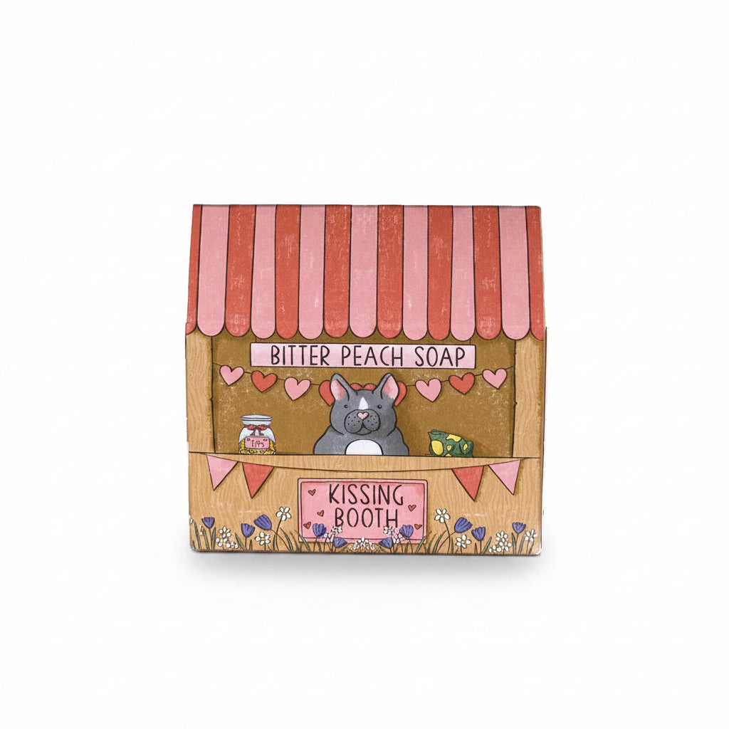 Neon Magpie Kissing Booth soap packaging showing illustrated kissing booth design.