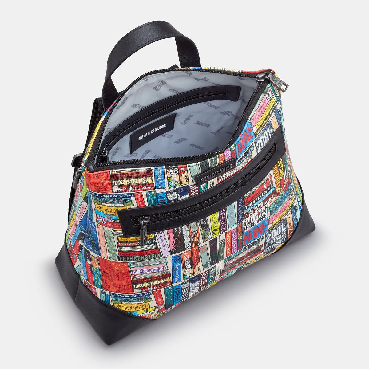 Classic Library Backpack in book spine print, black trim, angled view