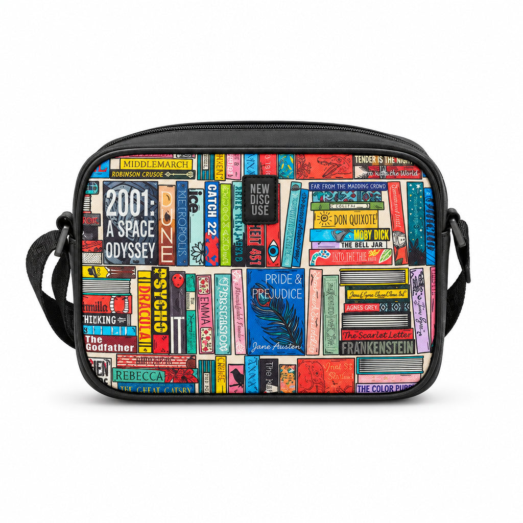 Classic Library Cross Body Bag in book spine print, black trim, front view on grey