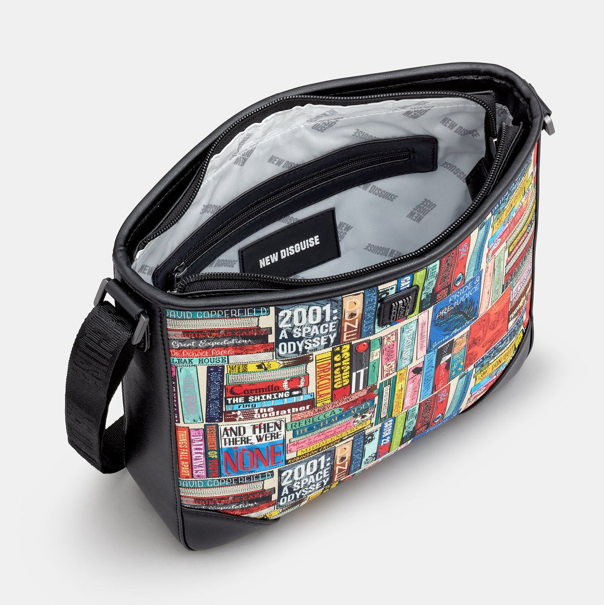 Classic Library Maxi Cross Body Bag in book spine print, black trim, angled view