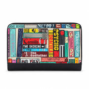Classic Library Zip Around Purse in book spine print, black trim, front view on grey