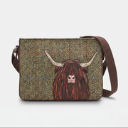 Highland cow cross body bag in green tweed-effect vegan leather, front view on grey