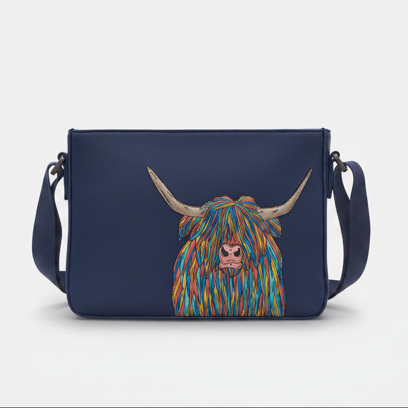 Highland cow cross body bag in navy vegan leather, front view on grey