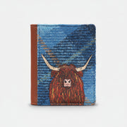 Highland cow flap-over card holder in blue tweed-effect vegan leather, front view on grey