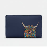 Highland cow flap-over purse in navy vegan leather, front view on grey