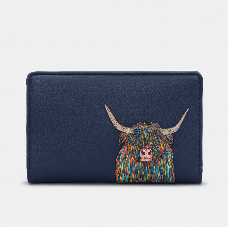 Highland cow flap-over purse in navy vegan leather, front view on grey