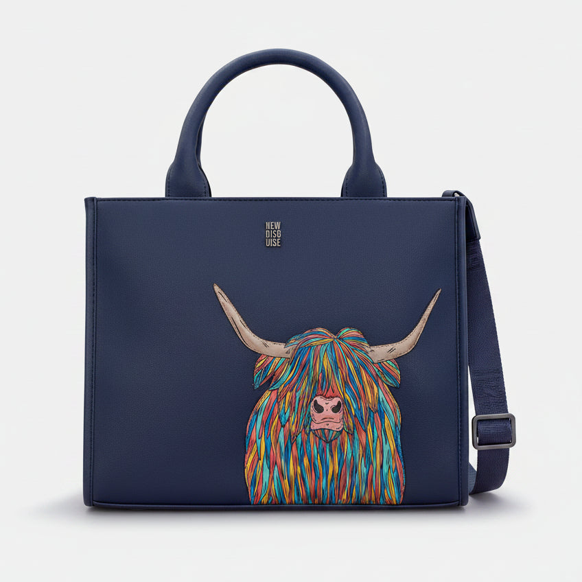 Highland cow tote bag in navy vegan leather, front view on grey